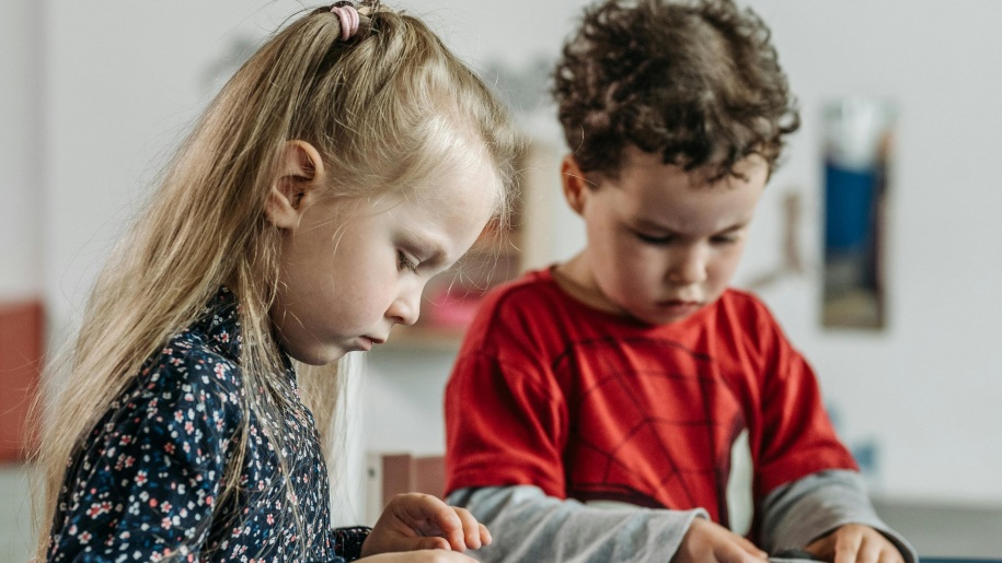 Two young children busy playing.