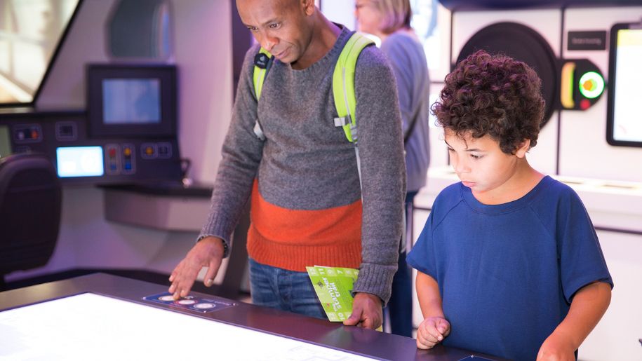 boy and father look at transport exhibit