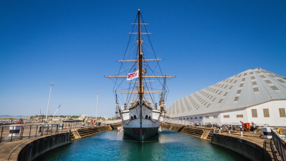 boat in marina with bright blue sky