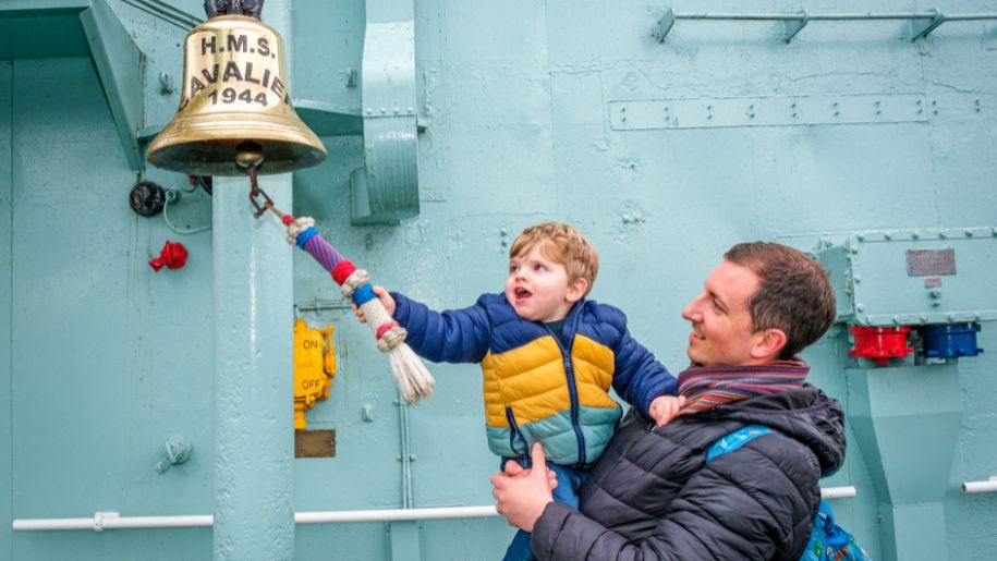 kid rings a ship bell
