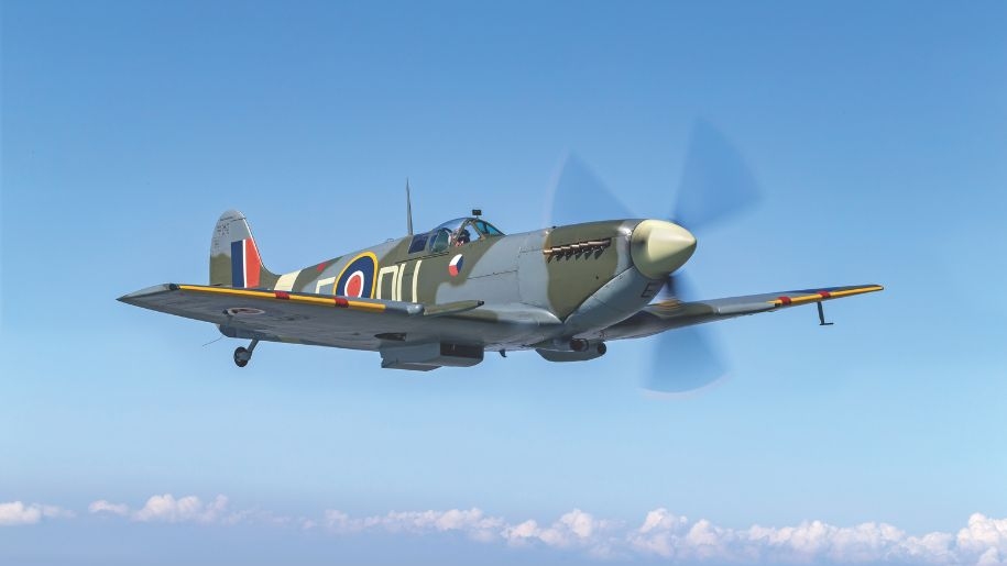 Military aircraft against a blue sky.