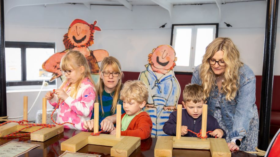 family enjoying the interactive exhibitions at the museum