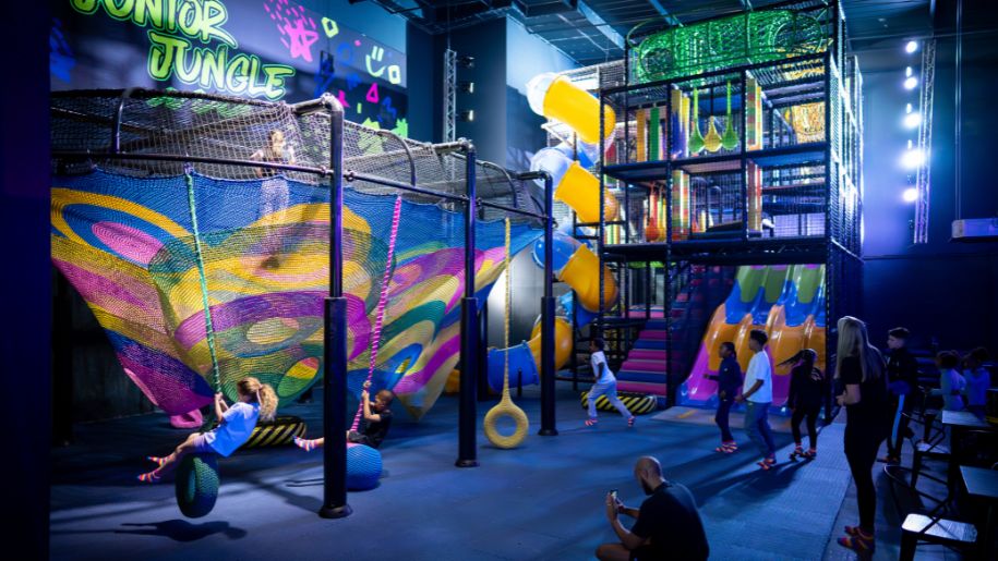 jungle gym in neon colours with children playing