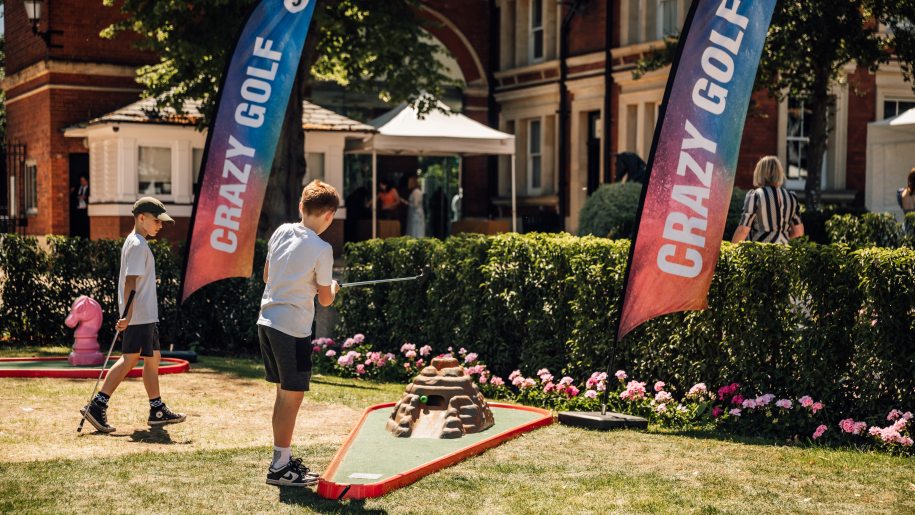 Children playing crazy golf.
