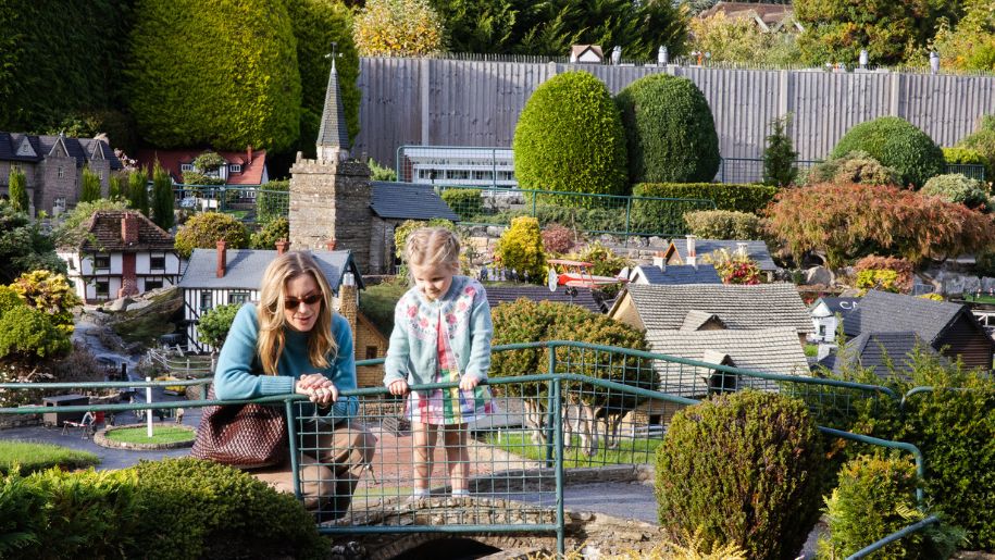 kids look at model village