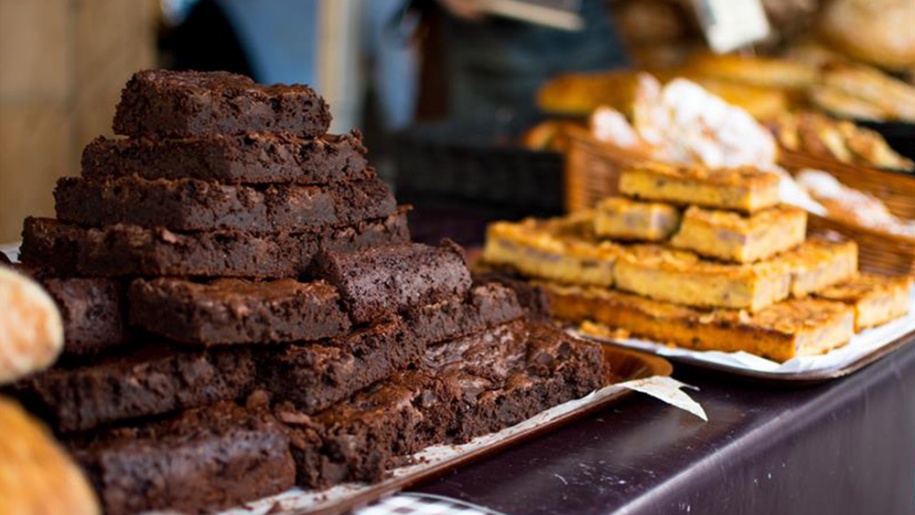 Pile of brownies on a plate.