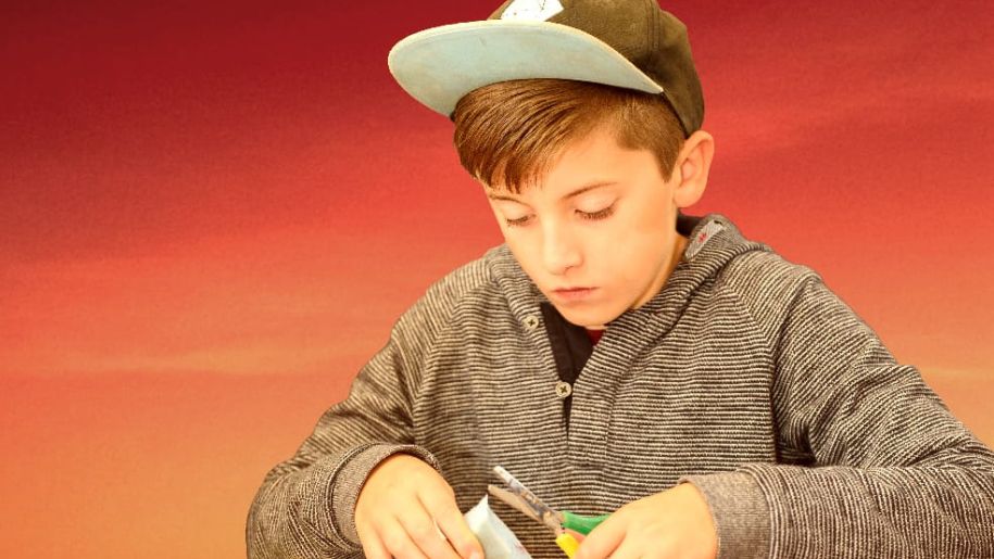 Boy cutting paper