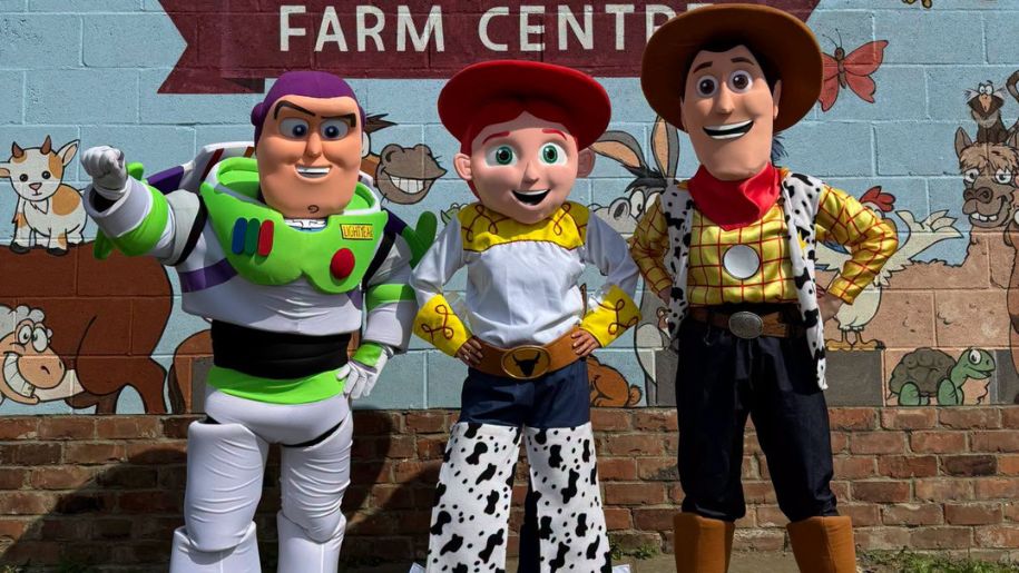 three people dressed as a cowboy, a cowgirl and a spaceman