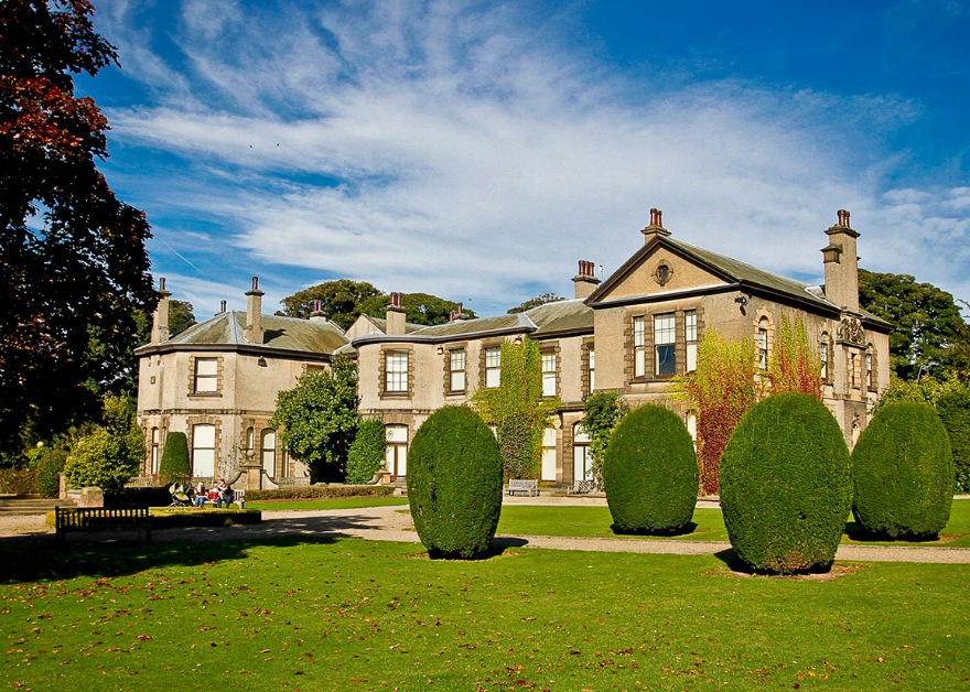 Large Mansion and garden with shrubs at Lotherton Hall
