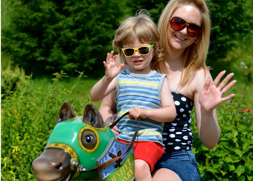 mother and child on carousel horse